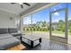 Screened-in porch with outdoor furniture and a beautiful backyard view at 1124 Cedar Farm Trl, Fuquay Varina, NC 27526
