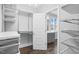 Spacious walk-in closet with shelving and hanging rods, adjacent to a well-lit bathroom at 1124 Cedar Farm Trl, Fuquay Varina, NC 27526
