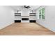 Bright living room with a modern electric fireplace and wood flooring at 114 Crow Dr, Louisburg, NC 27549