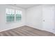 Cozy bedroom with plush carpeting, a window with blinds, and neutral wall color at 11640 International Dr, Middlesex, NC 27557