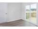 Bright view of a sliding glass door leading to a wood deck, adding to the room's charm at 11640 International Dr, Middlesex, NC 27557