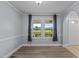 Inviting dining room featuring two large windows and views of the outdoor greenery at 1167 John D Winstead Rd, Roxboro, NC 27574