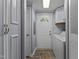 Hallway with laundry appliances and access to the exterior through a door with a window at 1167 John D Winstead Rd, Roxboro, NC 27574