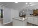 This kitchen has a grey countertop and white cabinets and plenty of storage at 1167 John D Winstead Rd, Roxboro, NC 27574