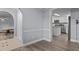 Modern kitchen featuring stainless steel appliances, white cabinetry, and a convenient breakfast bar at 1167 John D Winstead Rd, Roxboro, NC 27574