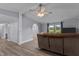 Comfortable living room with a ceiling fan, fresh paint, and large windows offering great natural light at 1167 John D Winstead Rd, Roxboro, NC 27574