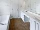 Bright bathroom with soaking tub, vanity with double sinks, and modern fixtures at 120 Point Harbor Dr, Cary, NC 27519