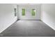 Spacious bedroom features neutral paint, plush carpeting, and lots of natural light from multiple windows at 120 Point Harbor Dr, Cary, NC 27519