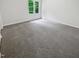 Neutral bedroom featuring large windows and neutral carpeting at 120 Point Harbor Dr, Cary, NC 27519
