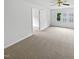 Bedroom with carpet, ceiling fan, and an open doorway to another room at 120 Point Harbor Dr, Cary, NC 27519