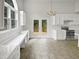 Bright kitchen features white cabinets, marbled countertops and stainless steel appliances at 120 Point Harbor Dr, Cary, NC 27519