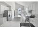 Stunning kitchen featuring white cabinets, granite countertops, and stainless steel appliances at 120 Point Harbor Dr, Cary, NC 27519