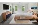 Bright main bedroom with a large bed, modern furnishings, and large windows with lovely views at 120 Point Harbor Dr, Cary, NC 27519