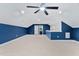Bright bonus room with an accent wall, carpet, and ensuite bathroom access at 125 Oswego Dr, Louisburg, NC 27549