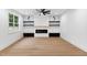 Bright living room featuring a fireplace, open shelving, and neutral tones at 125 Oswego Dr, Louisburg, NC 27549