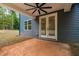 Back patio featuring ceiling fan and access to a large backyard at 125 Oswego Dr, Louisburg, NC 27549