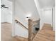 Staircase with modern design and natural wood and iron accents at 125 Oswego Dr, Louisburg, NC 27549