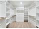 Walk-in closet with carpet, and organized shelving and rails for ample storage at 125 Oswego Dr, Louisburg, NC 27549