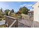 Wooden deck overlooks fenced backyard with gazebo and mature trees at 130 Virginia Water Dr, Rolesville, NC 27571