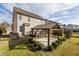 Inviting backyard featuring a wooden gazebo on a stone patio at 130 Virginia Water Dr, Rolesville, NC 27571