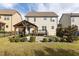 Well-maintained backyard with a covered patio and lush green lawn at 130 Virginia Water Dr, Rolesville, NC 27571