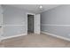 Bedroom with carpet, hanging light, and paneled walls at 130 Virginia Water Dr, Rolesville, NC 27571