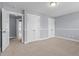 Bedroom with carpet, three windows and paneled walls at 130 Virginia Water Dr, Rolesville, NC 27571