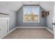 Bright bedroom with dormer window and built-in shelves at 130 Virginia Water Dr, Rolesville, NC 27571