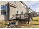 Cozy back deck and lush backyard featuring a pond at 130 Virginia Water Dr, Rolesville, NC 27571