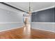 Spacious dining room with hardwood floors and fresh paint, offering a welcoming space for memorable dining experiences at 130 Virginia Water Dr, Rolesville, NC 27571