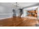 Spacious living room featuring hardwood floors, recessed lighting, and an open floor plan to the kitchen at 130 Virginia Water Dr, Rolesville, NC 27571
