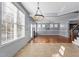 Spacious living room featuring hardwood floors, recessed lighting, and an open floor plan at 130 Virginia Water Dr, Rolesville, NC 27571