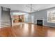 Inviting living space seamlessly connects to the kitchen with hardwood floors and staircase nearby at 130 Virginia Water Dr, Rolesville, NC 27571