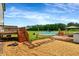 Backyard featuring a deck with stairs, inground pool, gazebo, and grassy area at 131 Hawick Ct, Zebulon, NC 27597