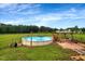 Backyard with inground pool, gazebo and lush grassy area at 131 Hawick Ct, Zebulon, NC 27597