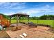 Backyard with gazebo and fire pit on a brick patio at 131 Hawick Ct, Zebulon, NC 27597