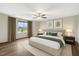 A bright, spacious bedroom featuring hardwood floors, a ceiling fan, and tranquil decor at 131 Hawick Ct, Zebulon, NC 27597