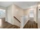 Upstairs hallway with modern flooring and neutral paint at 131 Hawick Ct, Zebulon, NC 27597
