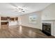 Spacious living area features a fireplace and an open view of the kitchen at 131 Hawick Ct, Zebulon, NC 27597