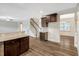 Open floor plan showcasing kitchen, stairs, and breakfast nook with modern lighting at 131 Hawick Ct, Zebulon, NC 27597