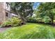 Expansive backyard with lush green lawn and wooden deck; perfect for relaxation at 1541 Caswell St, Raleigh, NC 27608