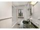 The bathroom features classic white tile, and a vanity with unique green stone countertop at 1541 Caswell St, Raleigh, NC 27608