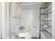A compact bathroom with white tile and classic fixtures at 1541 Caswell St, Raleigh, NC 27608