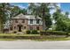 Charming brick two-story home with Tudor accents and manicured front yard in a desirable location at 1541 Caswell St, Raleigh, NC 27608