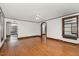 Bright, airy living room with hardwood floors, archways, ceiling fan, and dark trim at 1541 Caswell St, Raleigh, NC 27608