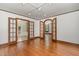 Spacious living room with wood floors and open view of adjacent room at 1541 Caswell St, Raleigh, NC 27608