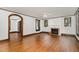 Charming living room featuring hardwood floors, fireplace, archways, and classic details at 1541 Caswell St, Raleigh, NC 27608