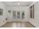 Sunroom featuring white walls, exposed brick, and natural light at 1541 Caswell St, Raleigh, NC 27608