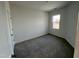 Cozy, carpeted bedroom with a window and neutral walls, ideal for relaxation and rest at 1945 Plott Balsam Dr, Wendell, NC 27591