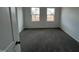 Bright bedroom featuring neutral walls, carpet flooring and two windows for an abundance of natural light at 1945 Plott Balsam Dr, Wendell, NC 27591